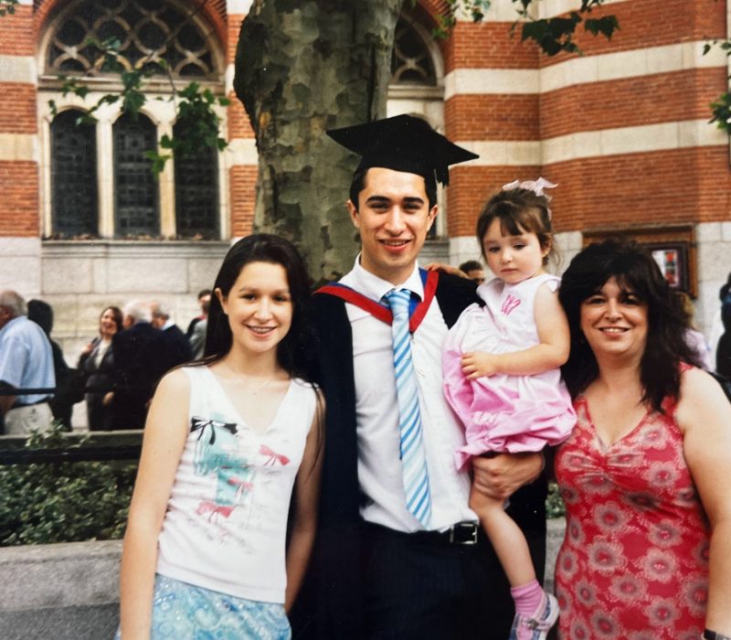 Damien at his graduation with his family